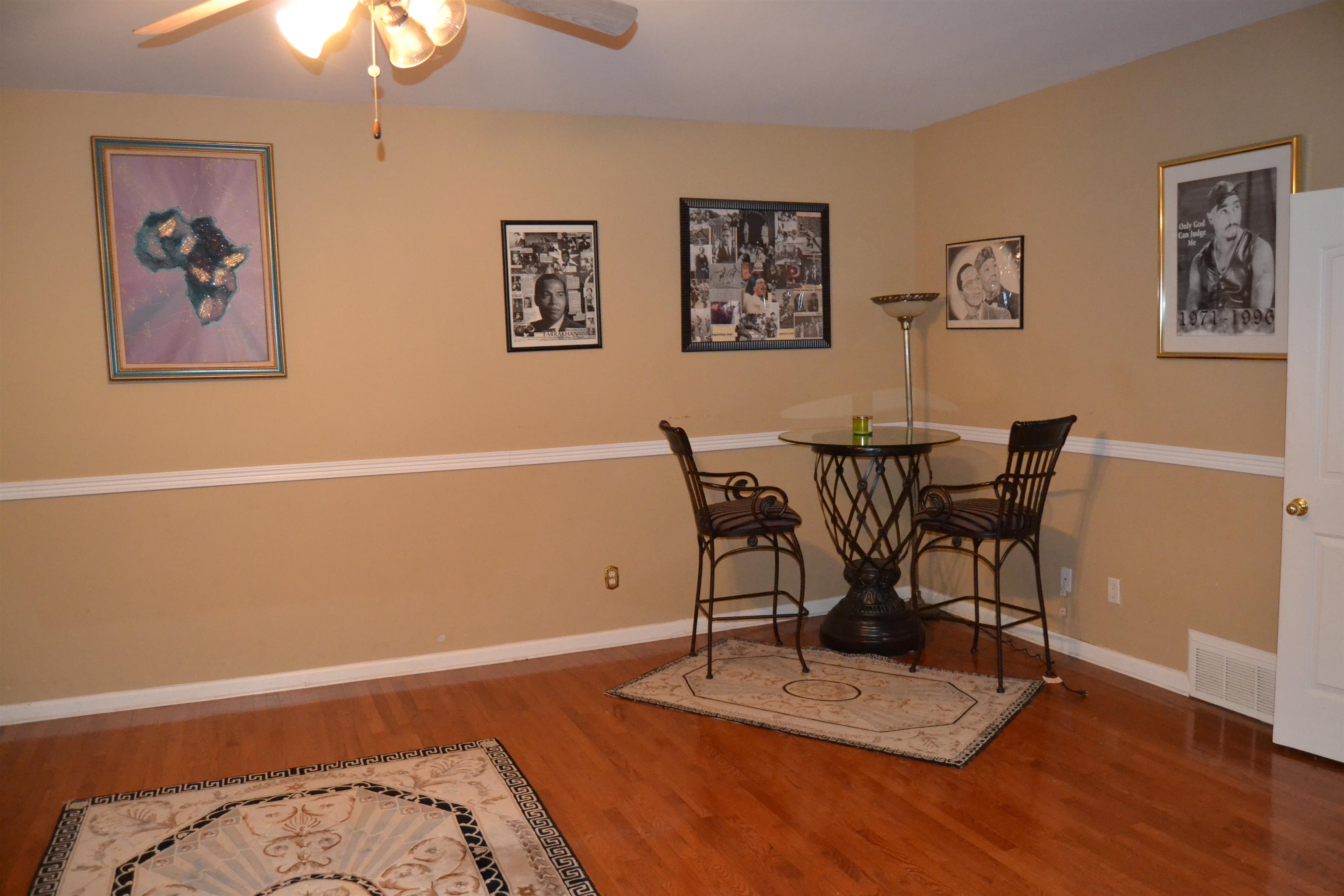 1364 Winoka Road Collierville, TN 38017 - Photo 20 of 25 a view of a workspace with furniture and wooden floor