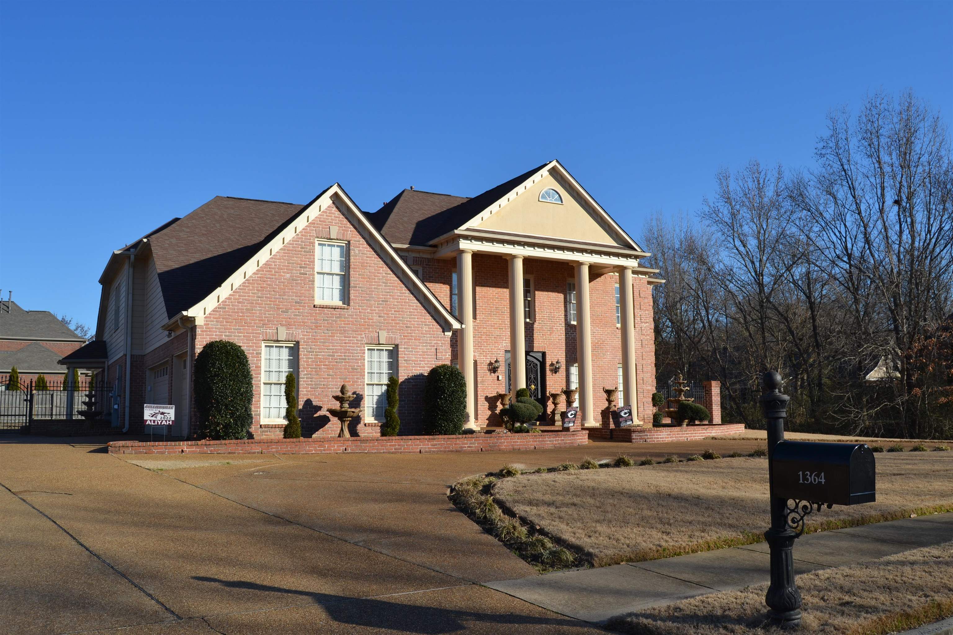1364 Winoka Road Collierville, TN 38017 - Photo 2 of 25 a view of a white house with a yard