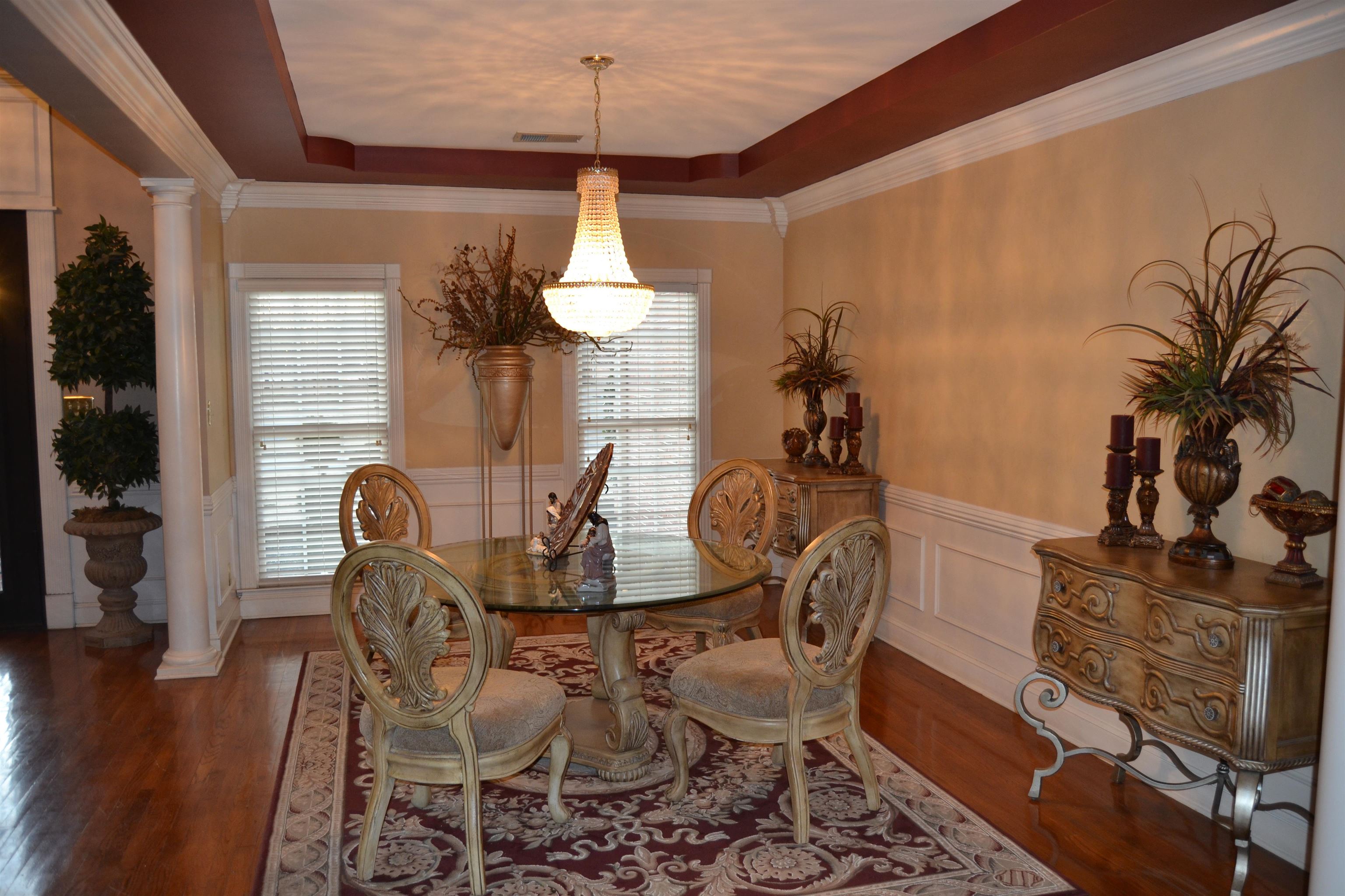 1364 Winoka Road Collierville, TN 38017 - Photo 6 of 25 a dining room with furniture a chandelier and wooden floor