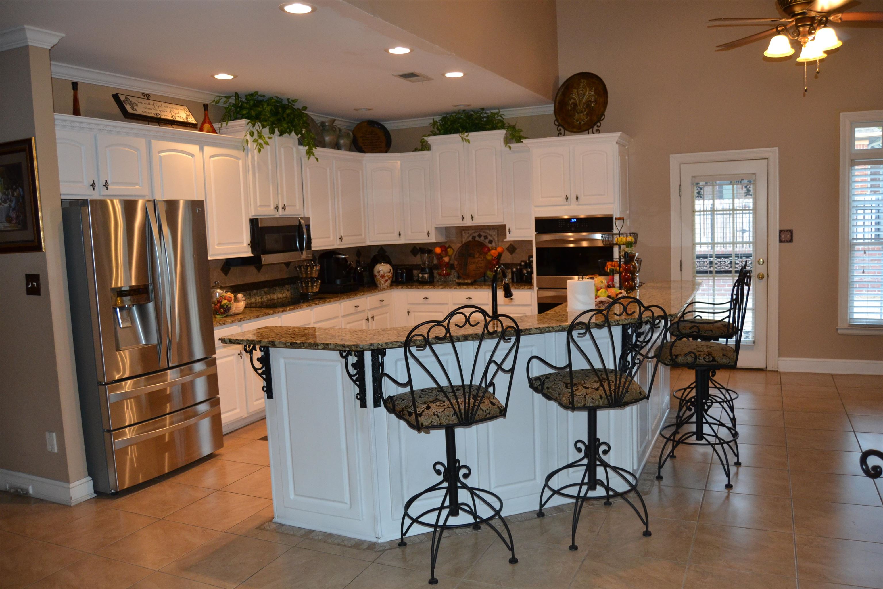 1364 Winoka Road Collierville, TN 38017 - Photo 9 of 25 a view of a dining room with furniture window and wooden floor