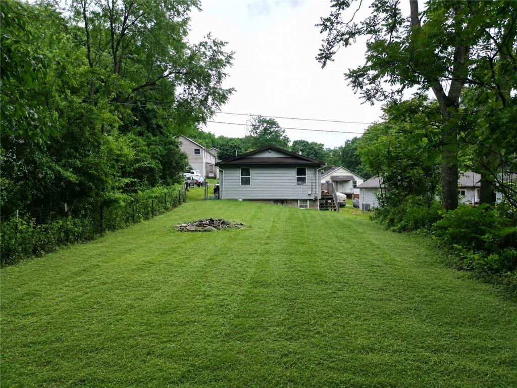 1119 Layton Road Butler, PA 16001 - Photo 24 of 25 a view of a big yard with plants and large trees