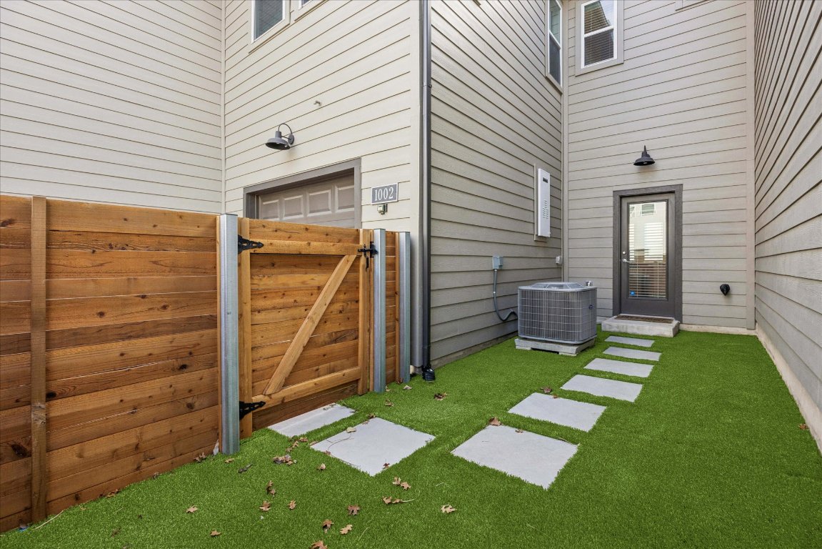 9015 Cattle Baron Path, Unit 1002 Austin, TX 78747 - Photo 17 of 21 a view of a backyard with stairs