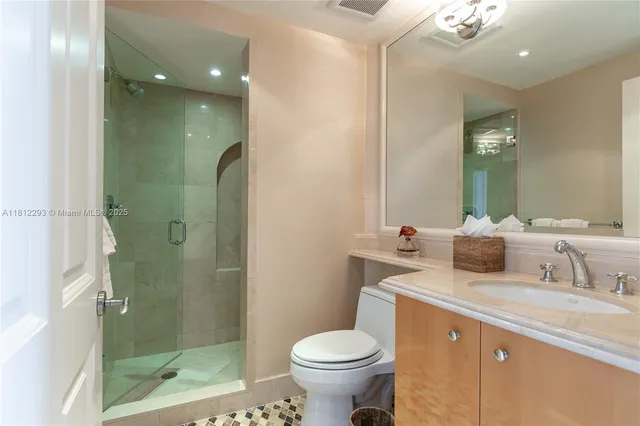 a view of bathroom with mirror and fan