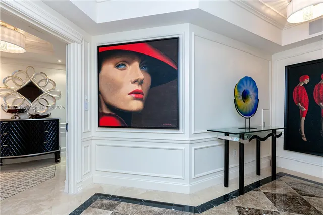 a bathroom with a granite countertop sink and white cabinets