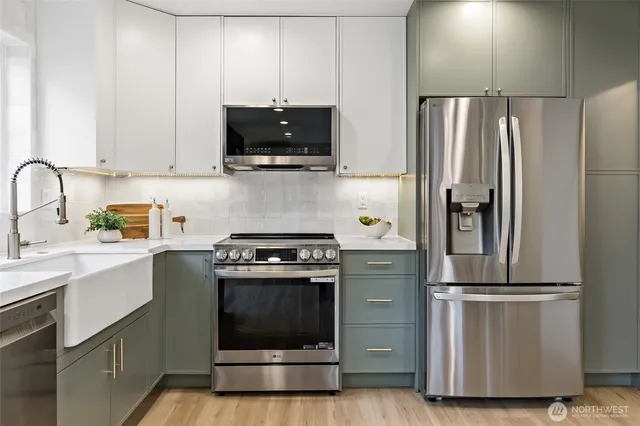 a kitchen with a stove microwave and refrigerator