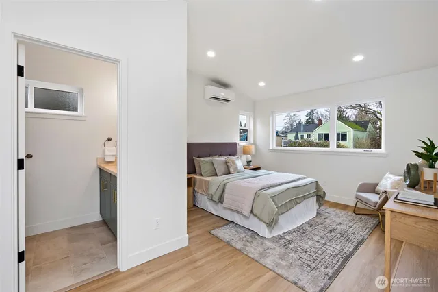 a room with a bed and a rug