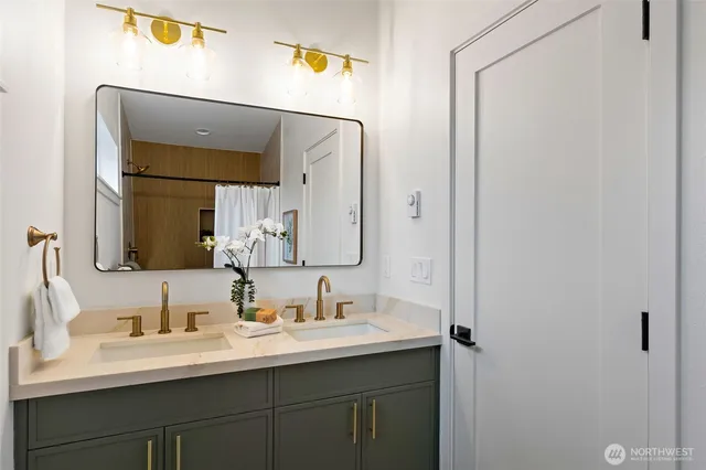 a bathroom with a sink and a mirror