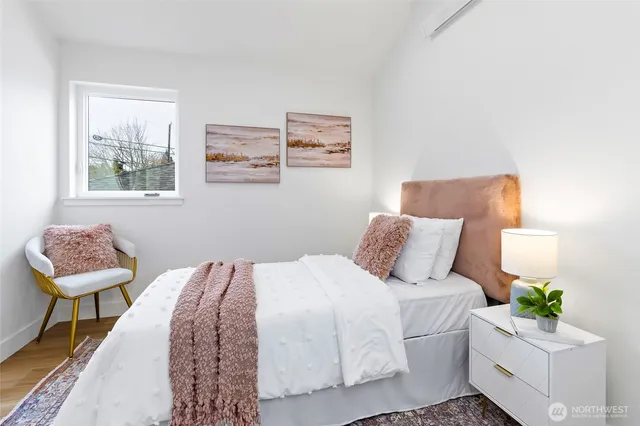 a bedroom with a bed and a lamp