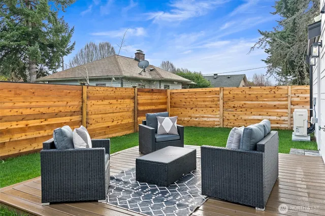swimming pool with outdoor seating and green space