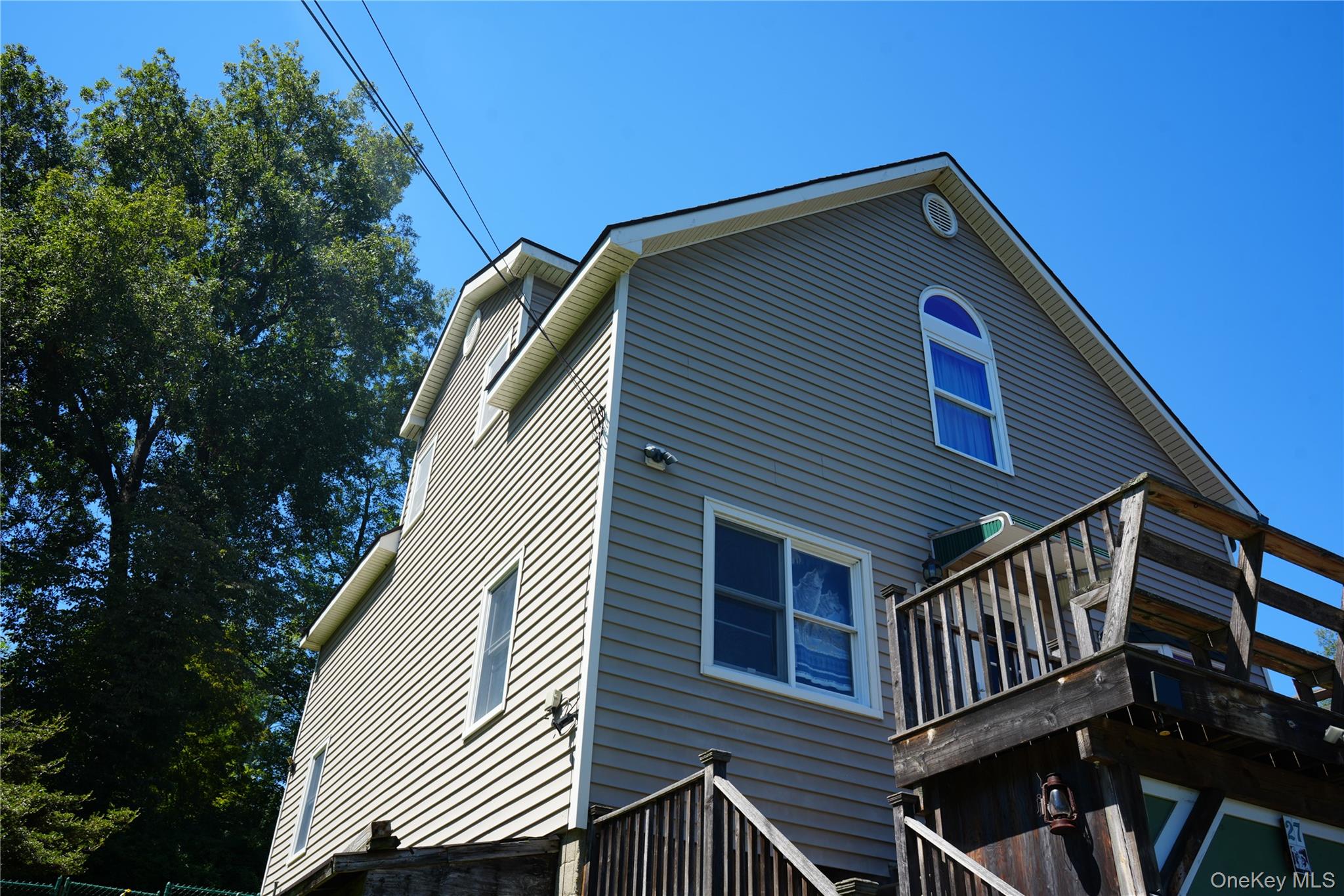 27 Spruce Street Lake Peekskill, NY 10537 - Photo 4 of 23 a view of a house with a deck