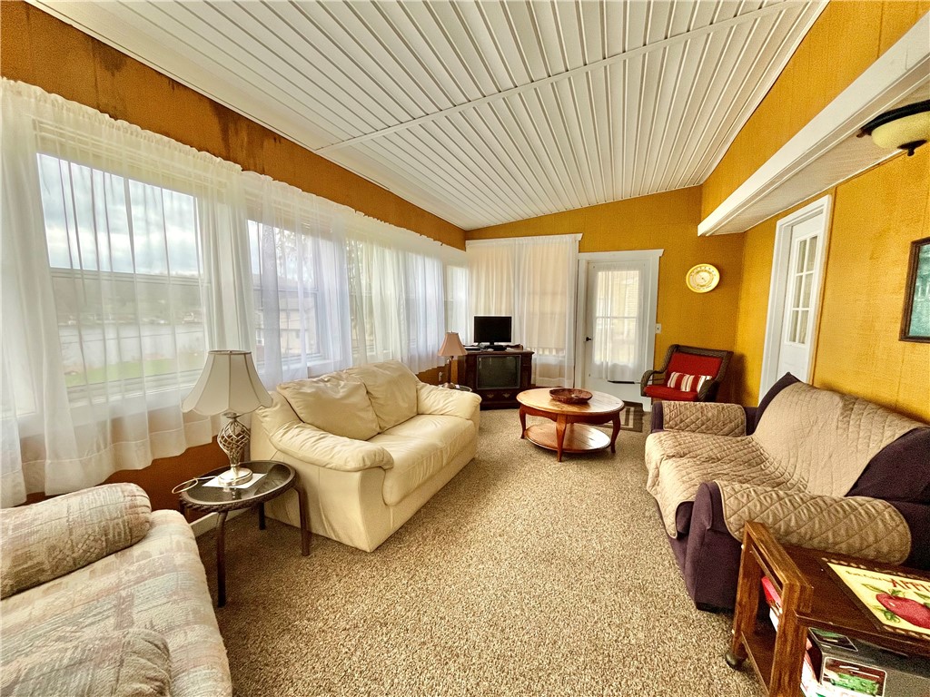7854 Eagle Road Wolcott, NY 14590 - Photo 7 of 23 Enclosed front porch/living area. Cottage is full