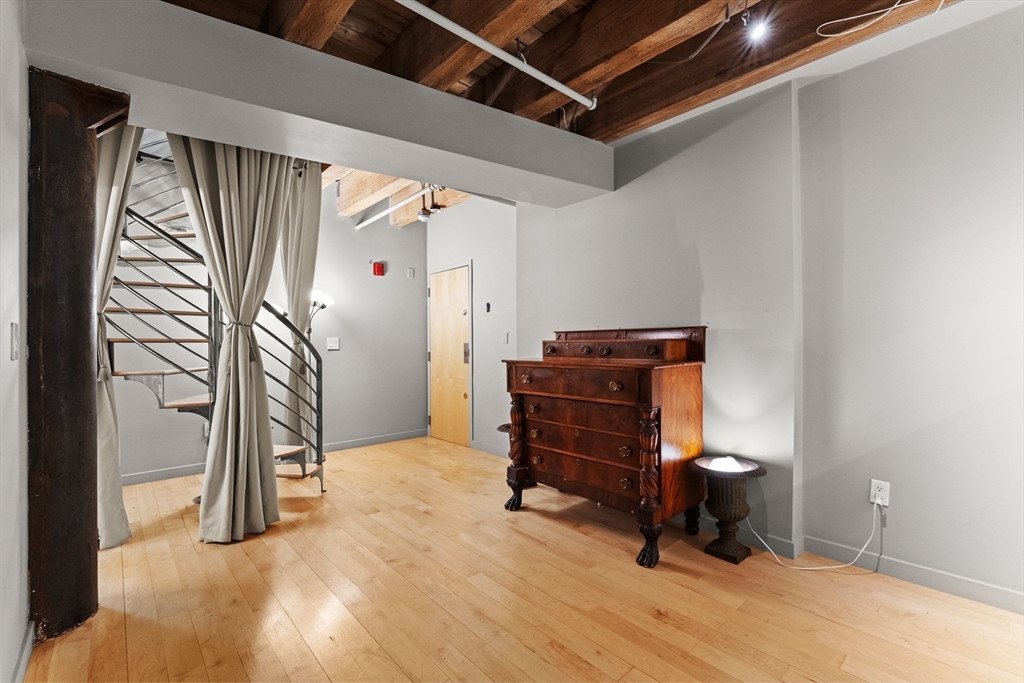 8 Newcomb Street, Unit 4 Boston, MA 02118 - Photo 10 of 16 a room with furniture and a piano