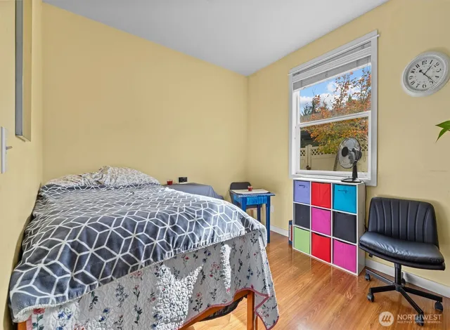 a bedroom with a bed and a chair