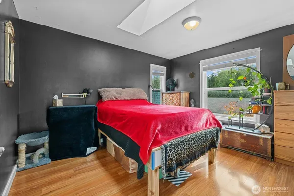 a bed room with a bed and a window