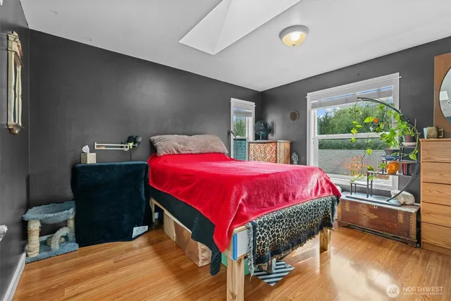 a bed room with a bed and a window