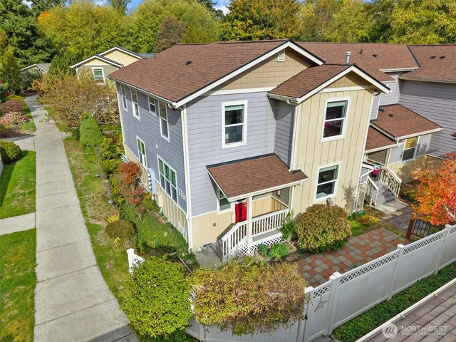 a aerial view of a house with a small yard and potted plants