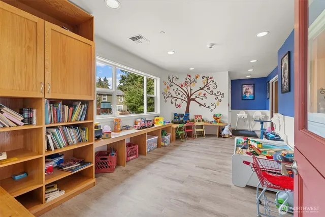 a kitchen with a sink a stove cabinets and a refrigerator