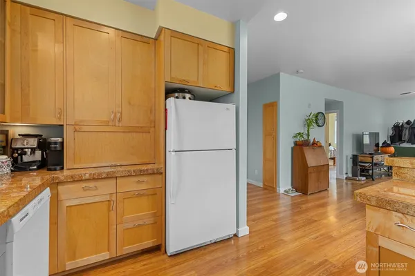 a white refrigerator freezer sitting in a kitchen