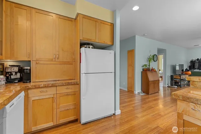 a white refrigerator freezer sitting in a kitchen