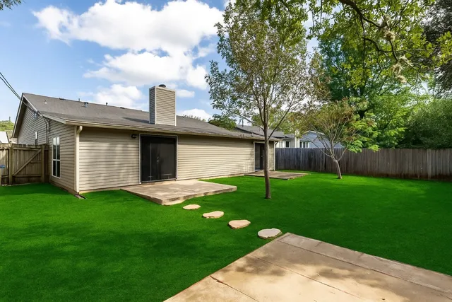 a backyard of a house with lots of green space