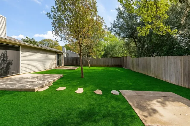 a view of a backyard with a small cabin