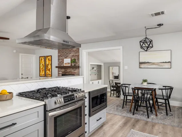 a kitchen with a table and chairs in it