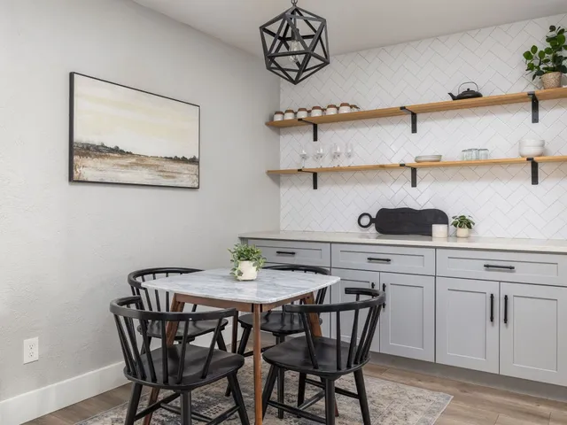 a view of a dining room with furniture and wooden floor