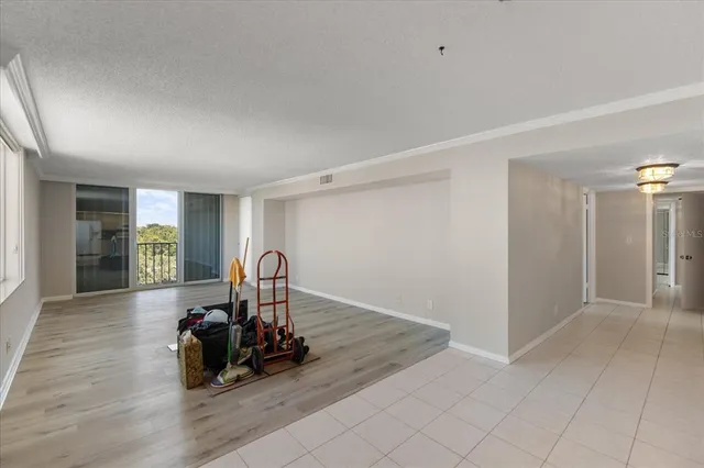 a view of a room with toys and wooden floor
