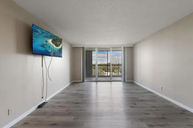 a view of an empty room with a window