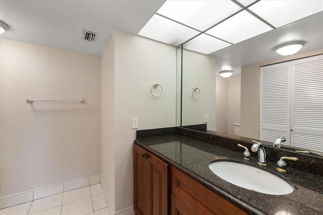 a view of a room with a mirror and racks on a wall