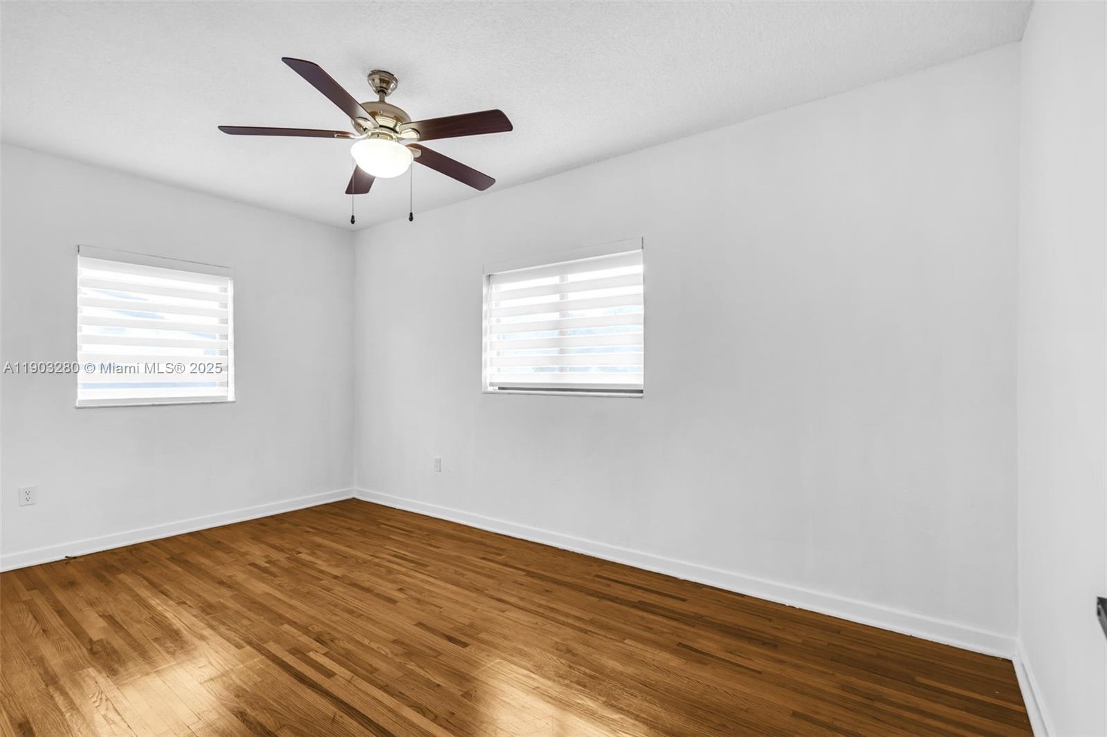 175 West 56th Street Hialeah, FL 33012 - Photo 11 of 39 a view of empty room with wooden floor