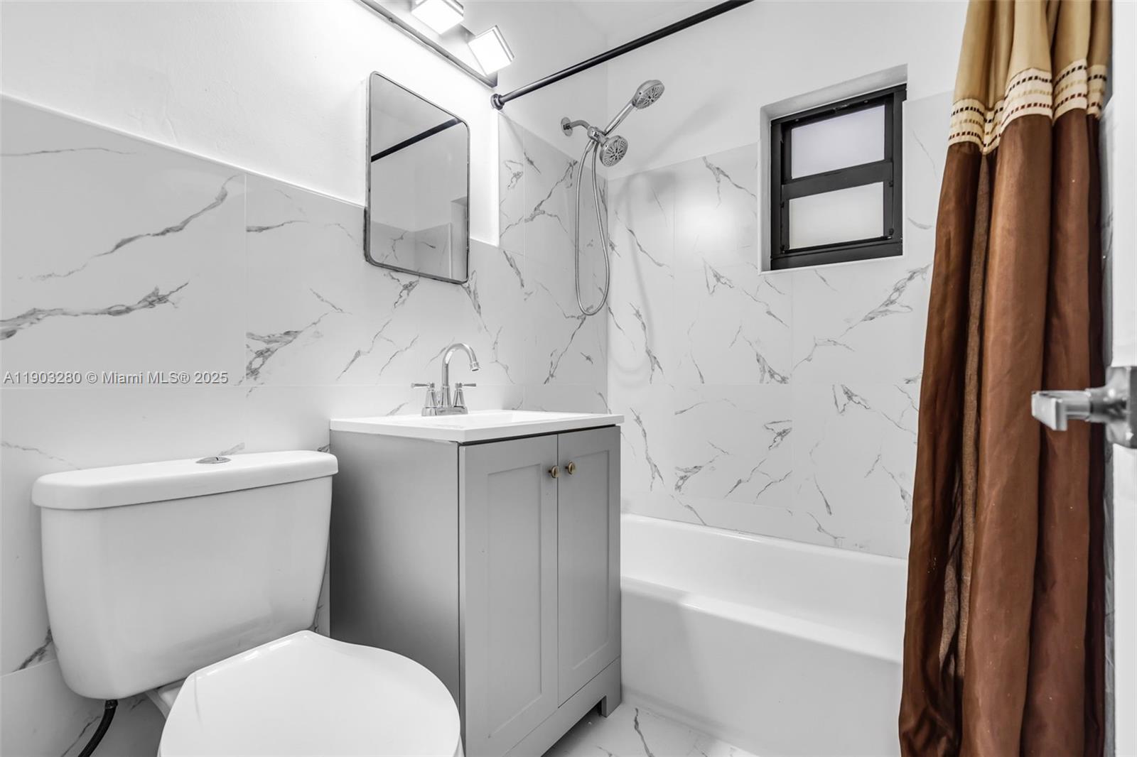 175 West 56th Street Hialeah, FL 33012 - Photo 15 of 39 a bathroom with a toilet sink and shower