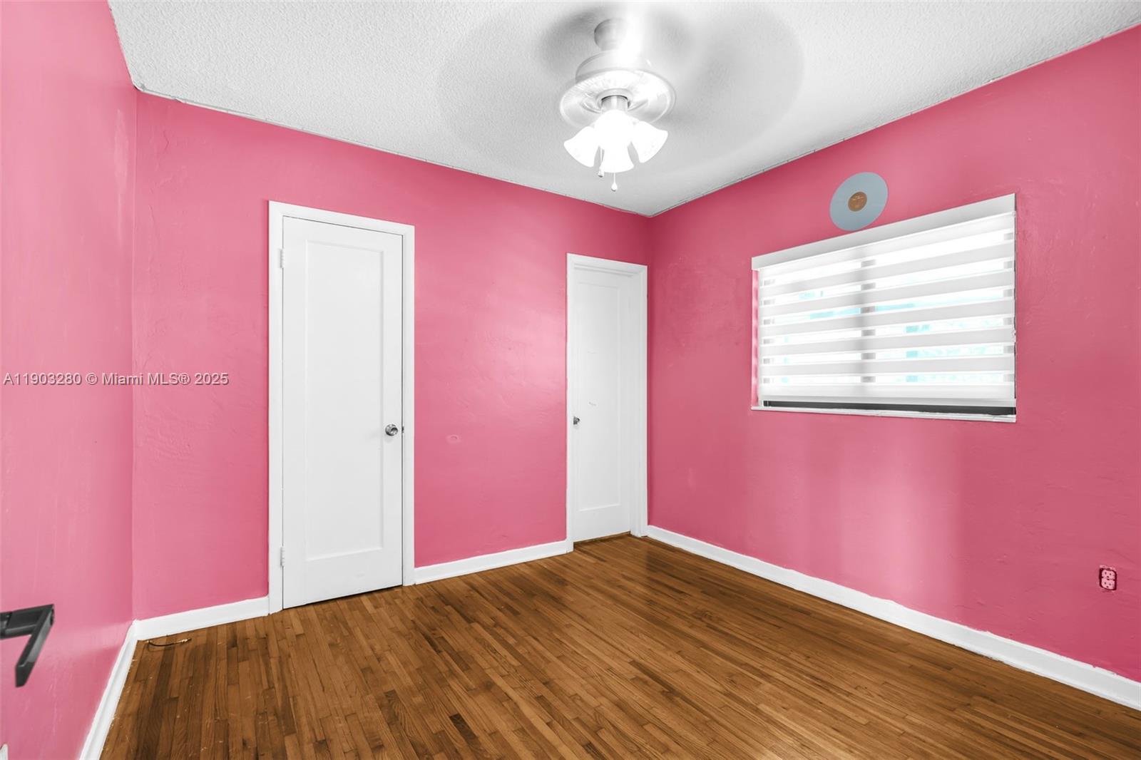 175 West 56th Street Hialeah, FL 33012 - Photo 16 of 39 a view of empty room with wooden floor and fan