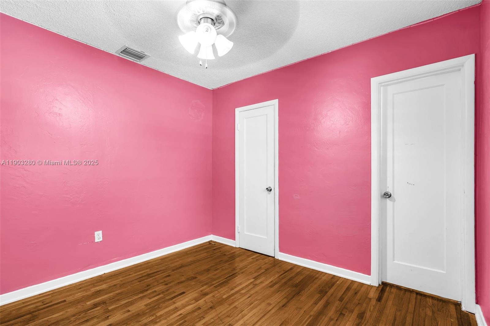 175 West 56th Street Hialeah, FL 33012 - Photo 17 of 39 a view of empty room with wooden floor