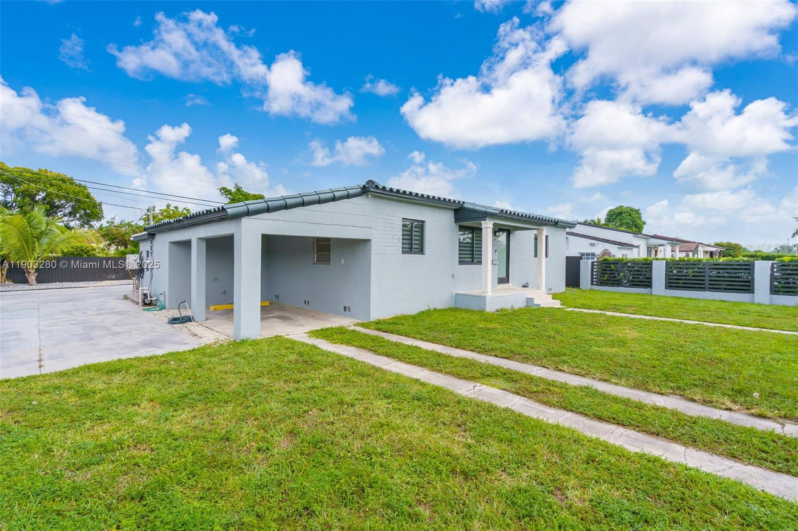 175 West 56th Street Hialeah, FL 33012 - Photo 2 of 39 a front view of house with yard and green space