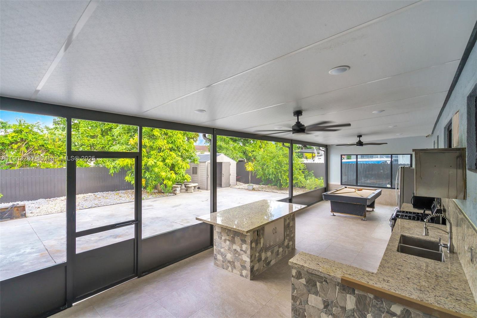 175 West 56th Street Hialeah, FL 33012 - Photo 24 of 39 a living room with furniture and a large window