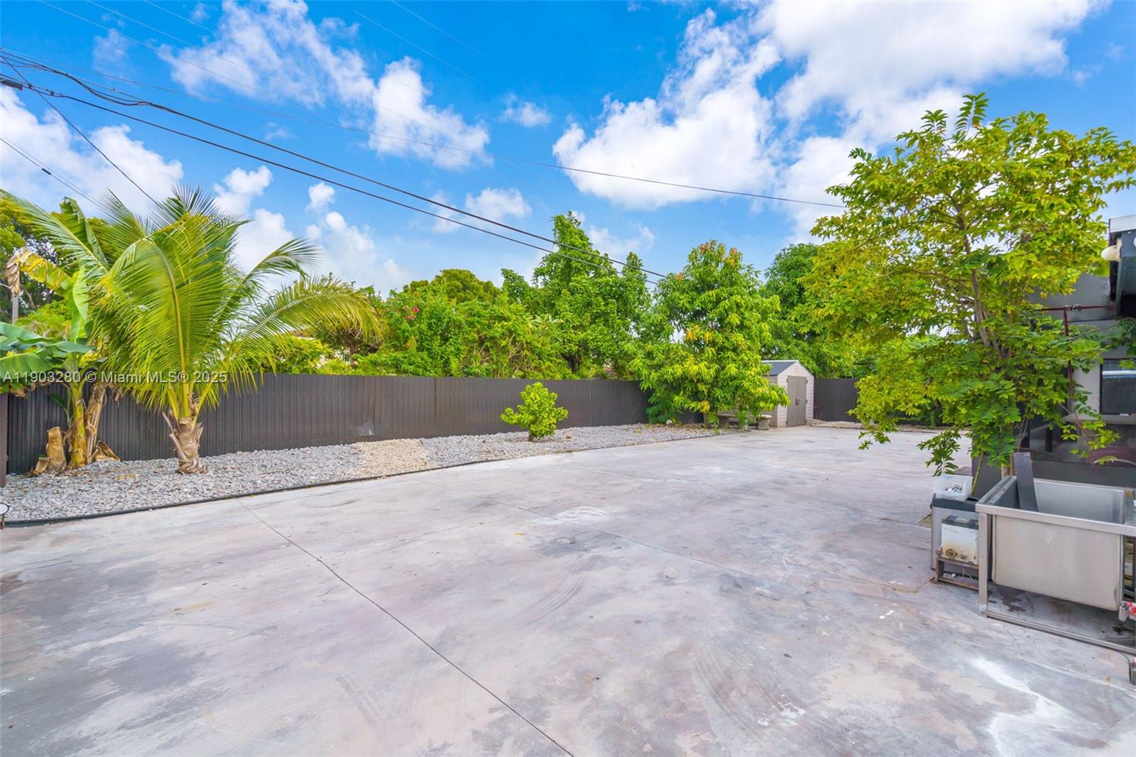 175 West 56th Street Hialeah, FL 33012 - Photo 28 of 39 a street view with potted plants