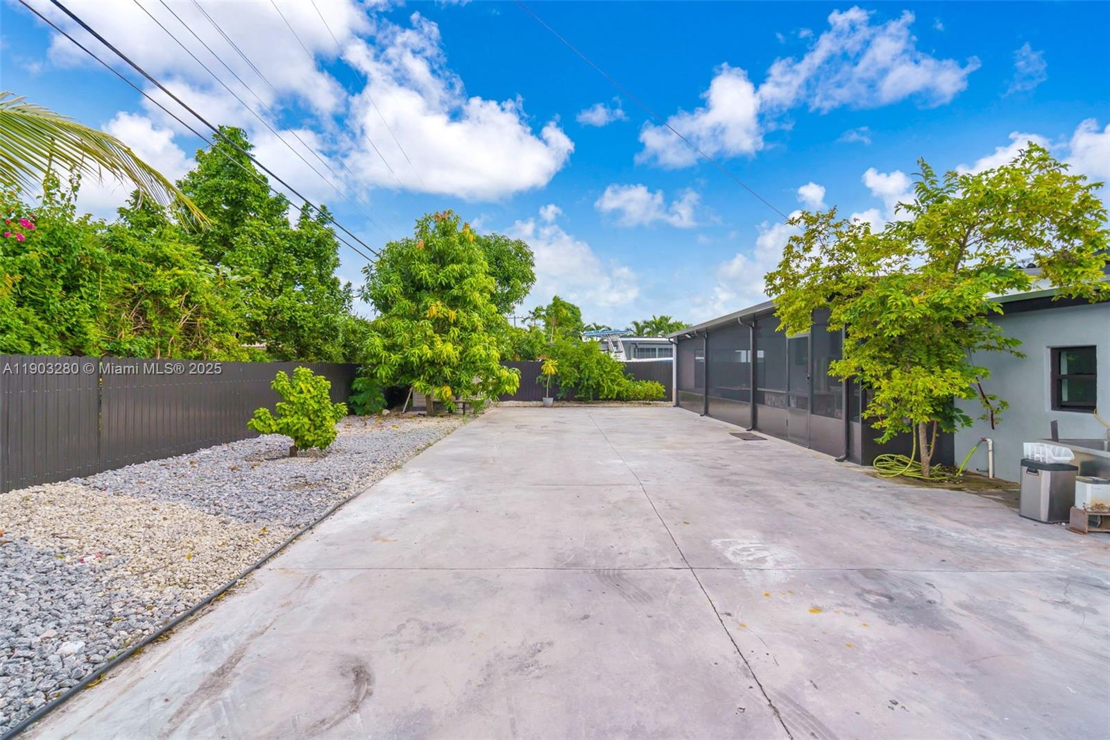 175 West 56th Street Hialeah, FL 33012 - Photo 29 of 39 a view of a house with a yard and potted plants