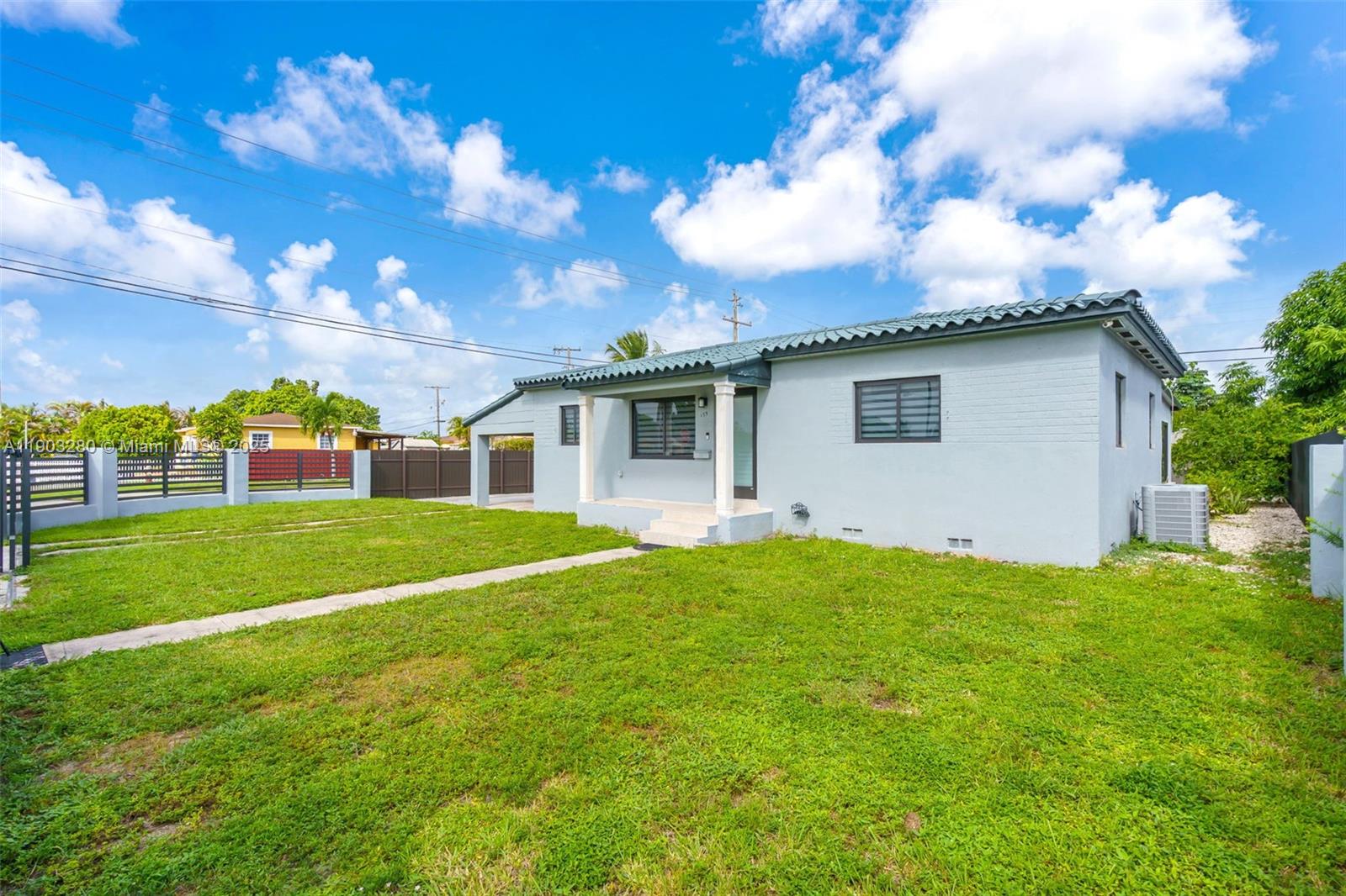 175 West 56th Street Hialeah, FL 33012 - Photo 3 of 39 a view of a house with backyard and garden