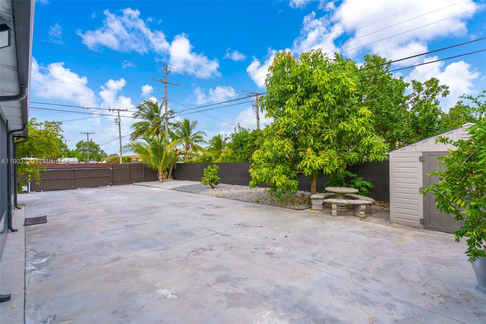 175 West 56th Street Hialeah, FL 33012 - Photo 32 of 39 a view of a patio with a table and chairs and potted plants