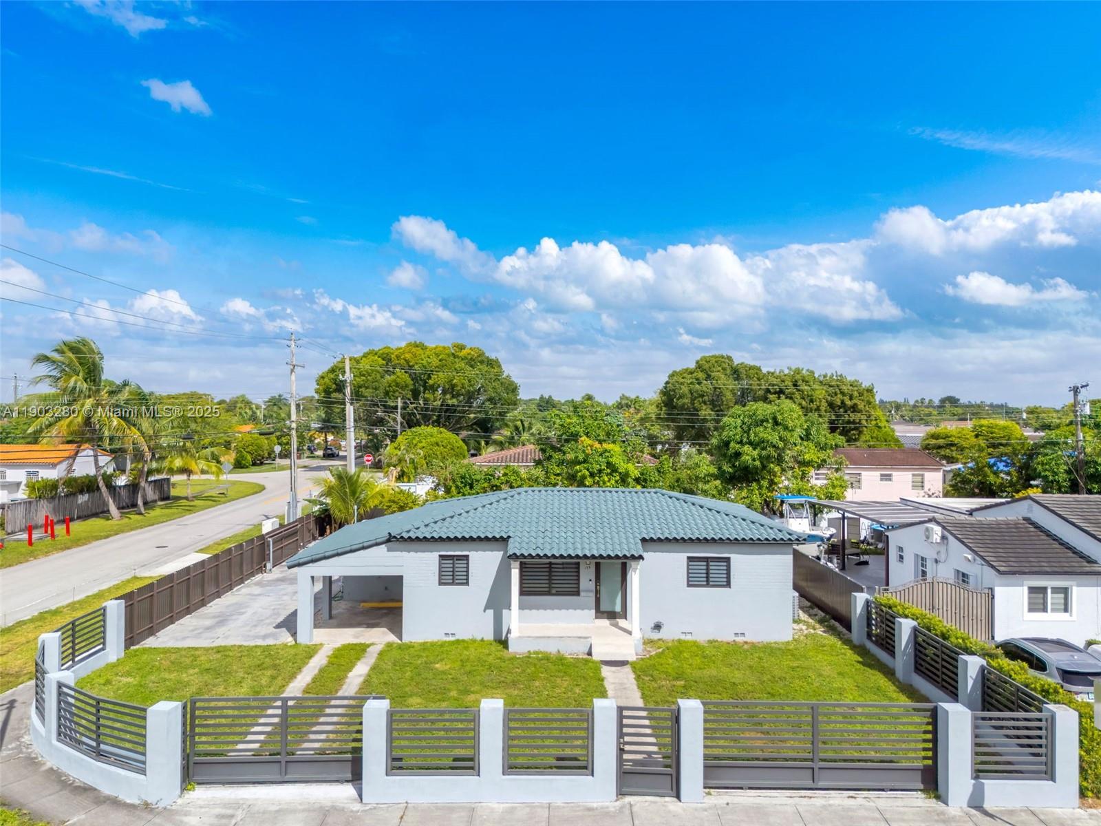175 West 56th Street Hialeah, FL 33012 - Photo 33 of 39 a view of a house with a swimming pool