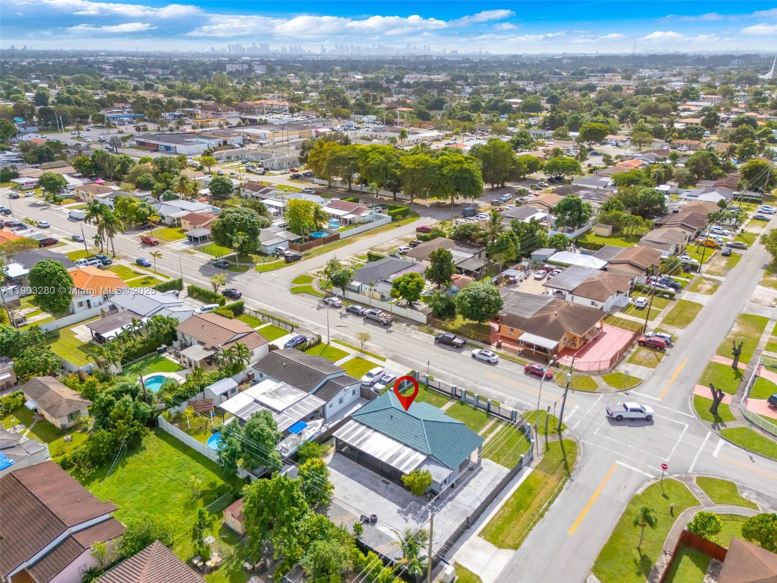 175 West 56th Street Hialeah, FL 33012 - Photo 37 of 39 an aerial view of residential houses with outdoor space and parking
