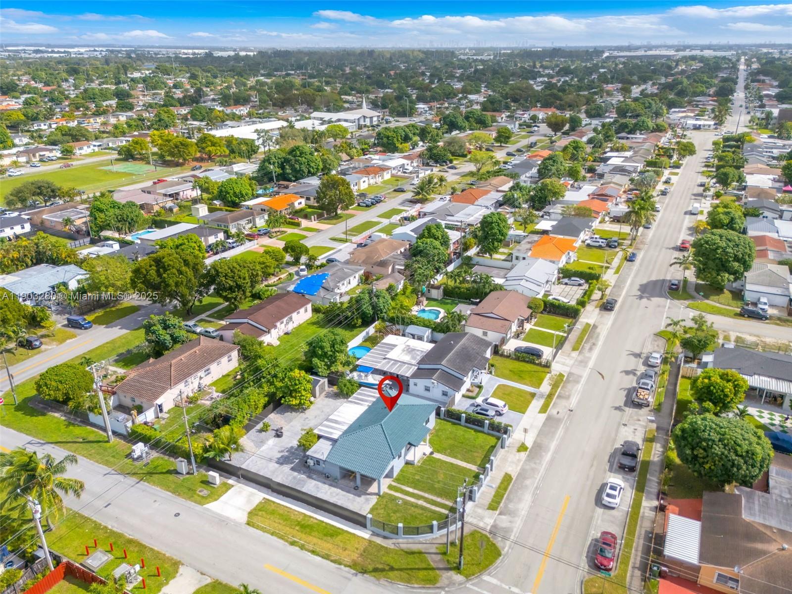 175 West 56th Street Hialeah, FL 33012 - Photo 38 of 39 an aerial view of residential houses with outdoor space and parking