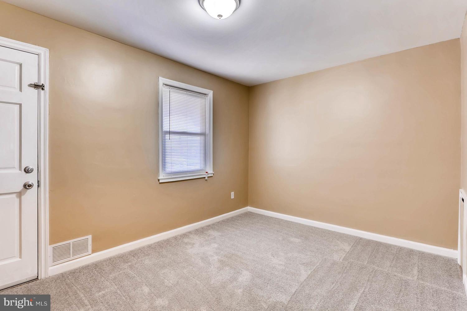7530 Westfield Road Baltimore, MD 21222 - Photo 17 of 30 a view of an empty room with a window