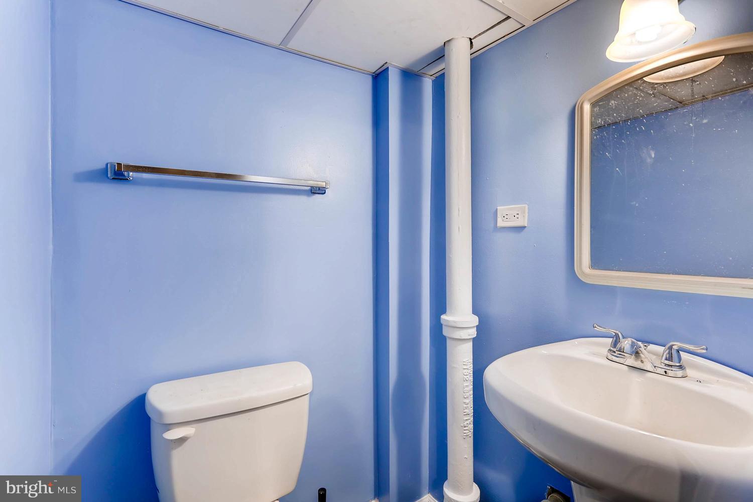 7530 Westfield Road Baltimore, MD 21222 - Photo 21 of 30 a bathroom with a sink a toilet and shower