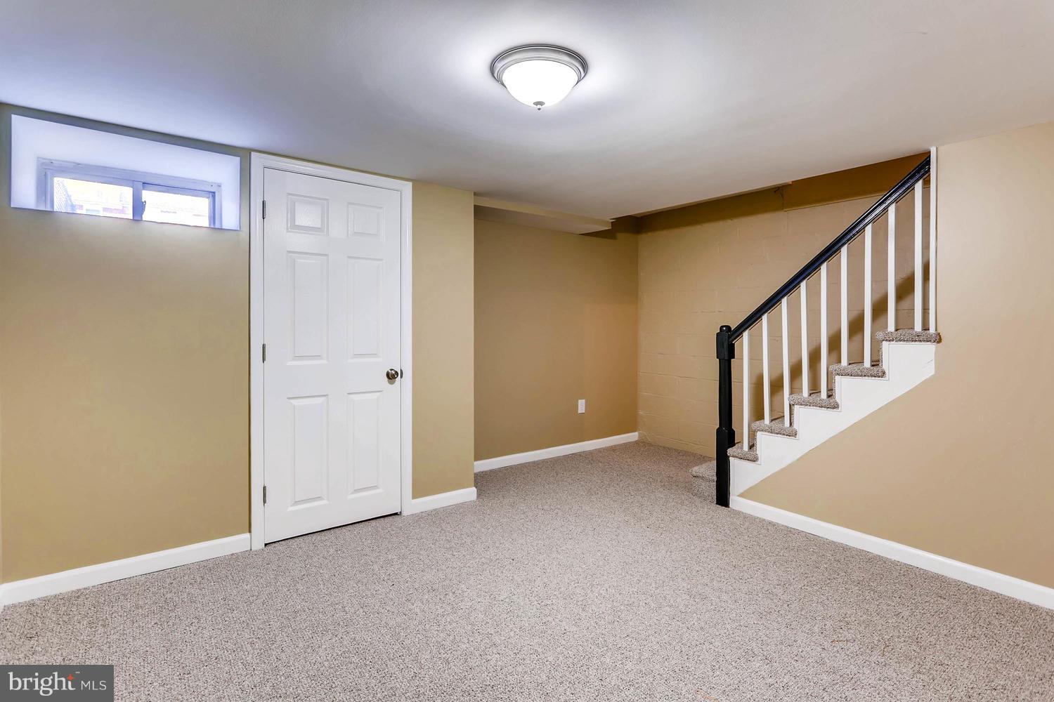 7530 Westfield Road Baltimore, MD 21222 - Photo 22 of 30 a view of an empty room with stairs