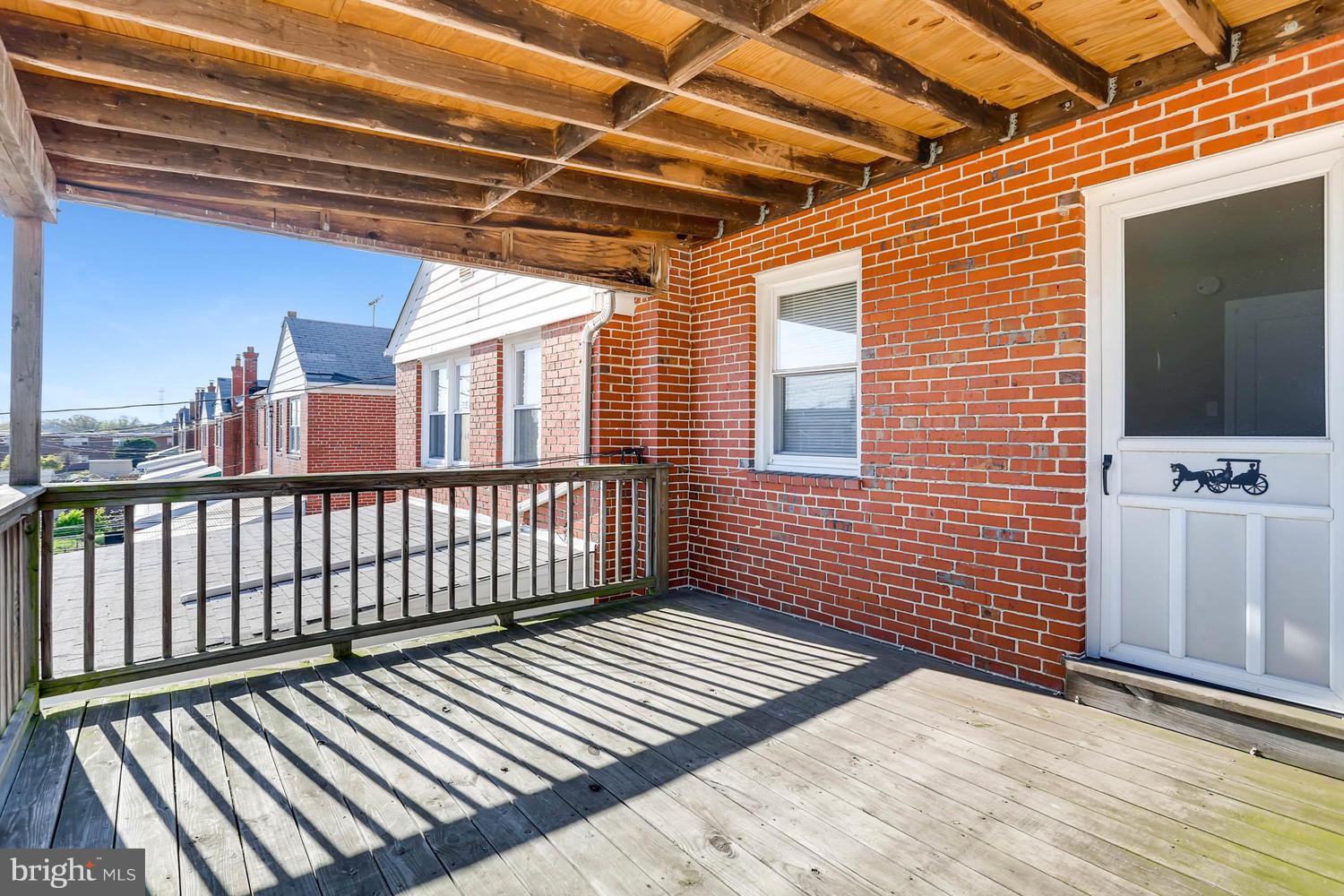 7530 Westfield Road Baltimore, MD 21222 - Photo 27 of 30 a view of a balcony with wooden floor