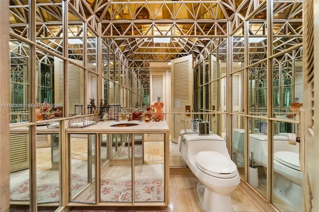 a bathroom with a toilet a sink and shower