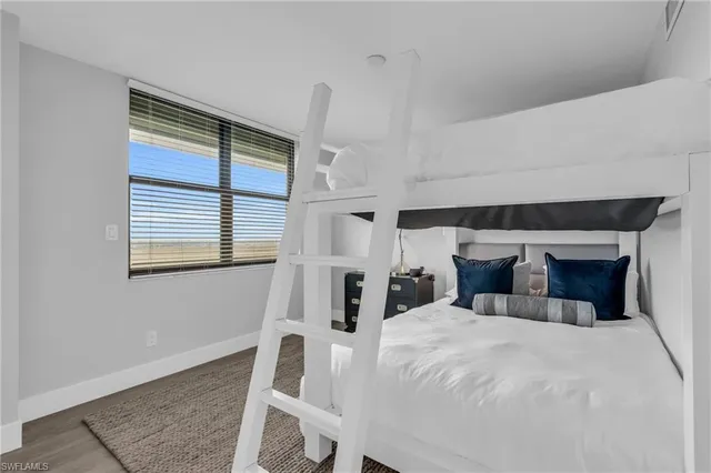 a large white bed in a white room