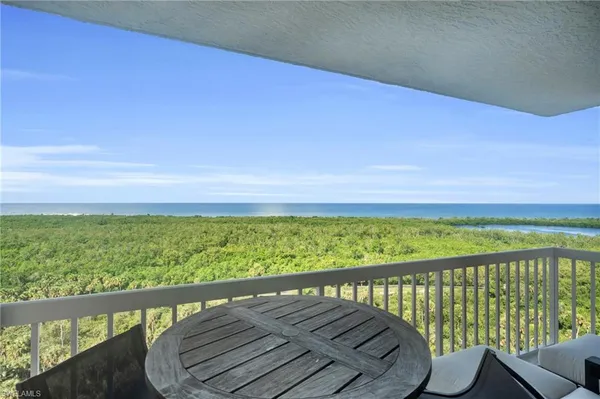 a view of a balcony with an ocean